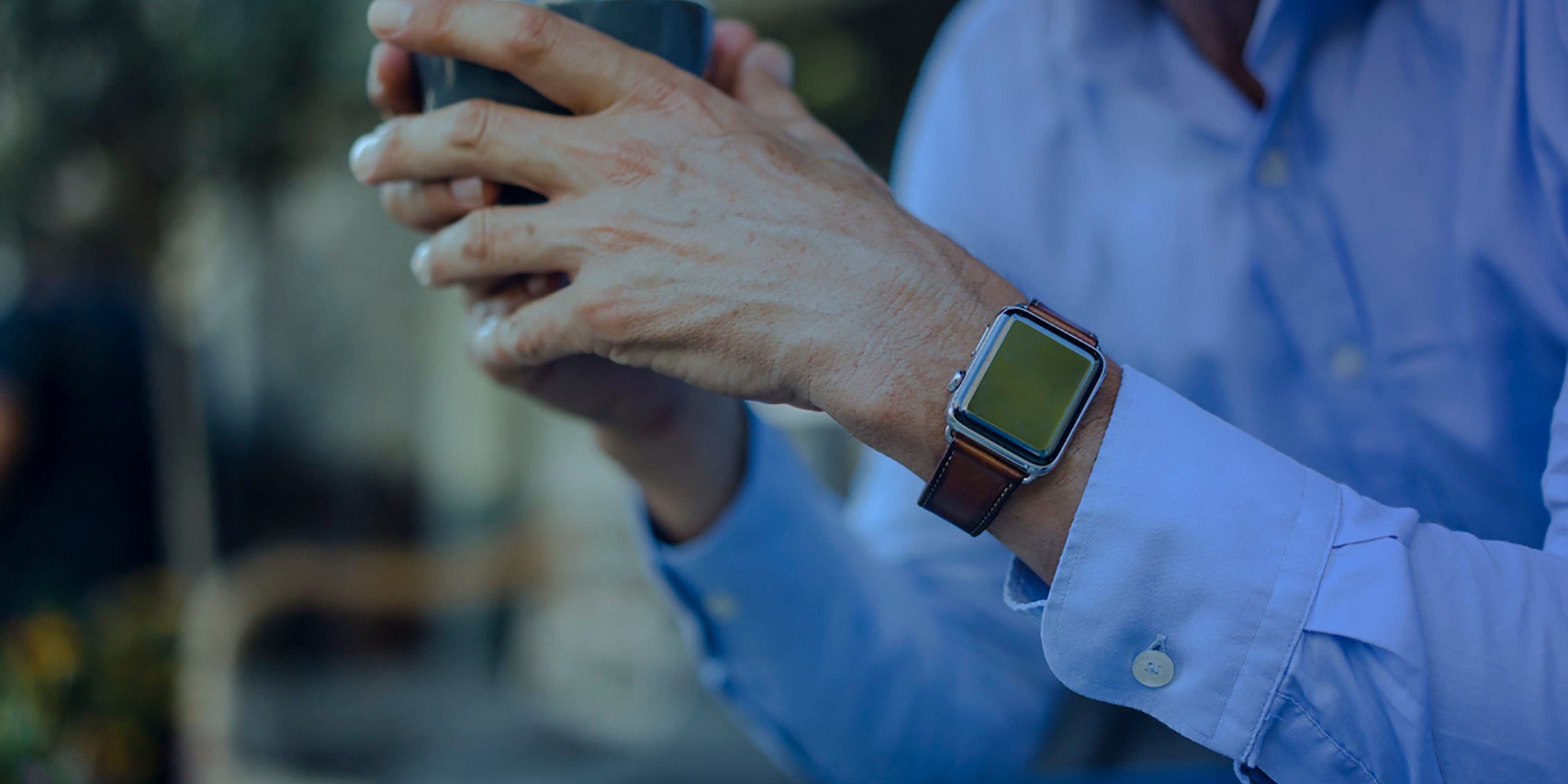 Man wearing smart watch wearable device.