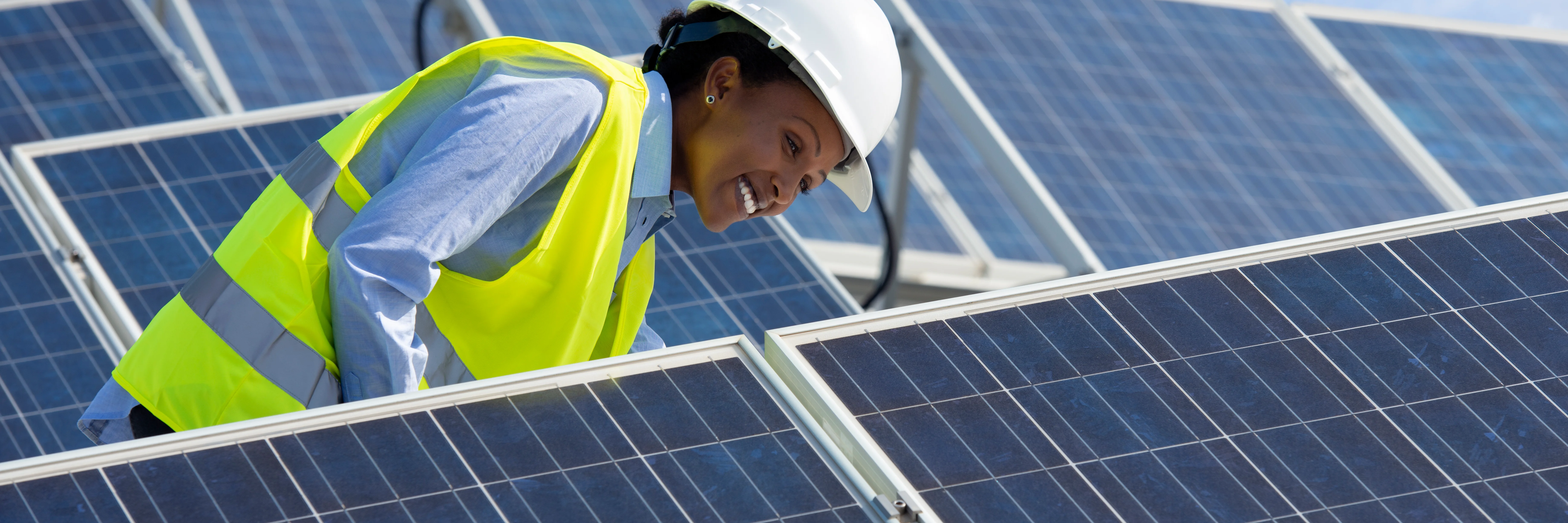 Female engineer with solar panels  - HSB Engineering Services