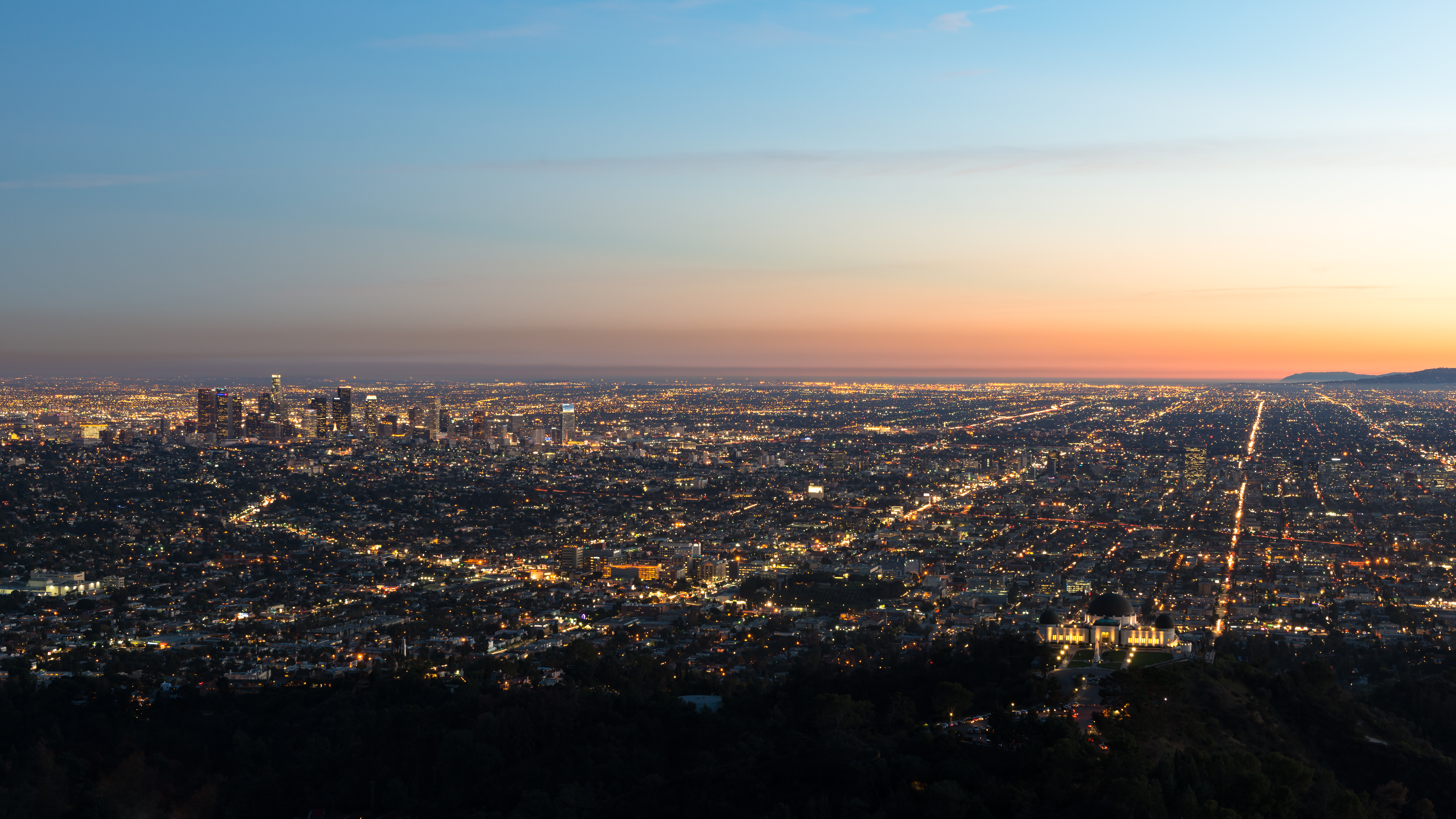 USA, California, Los Angeles, Illuminated cityscape at sunrise
