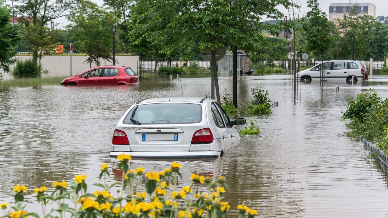 How climate hazards compound across portfolios Cars stuck in flooded streets