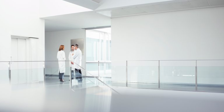 Doctors talking in hospital corridor