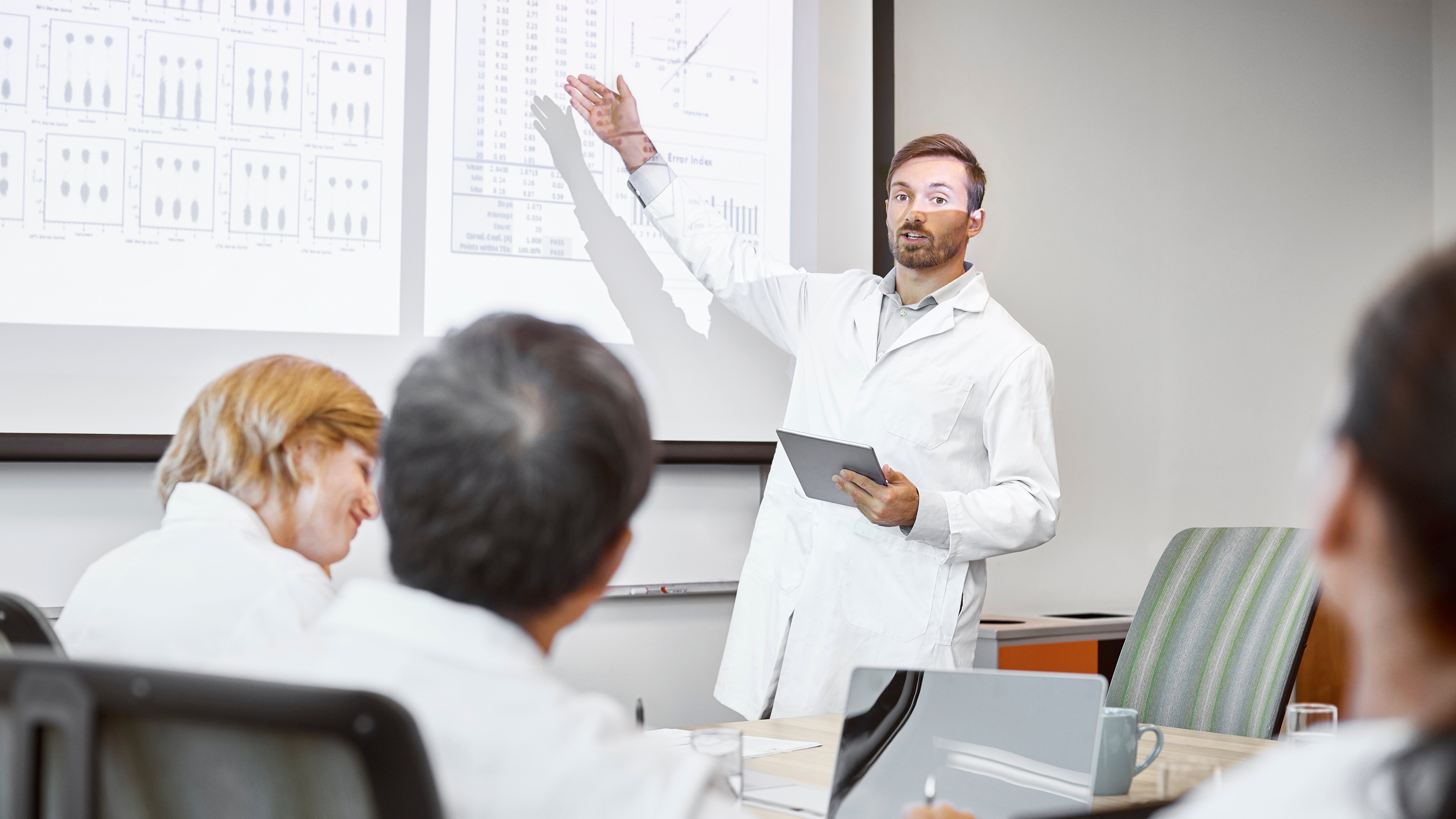 Scientists discussing over cancer treatment