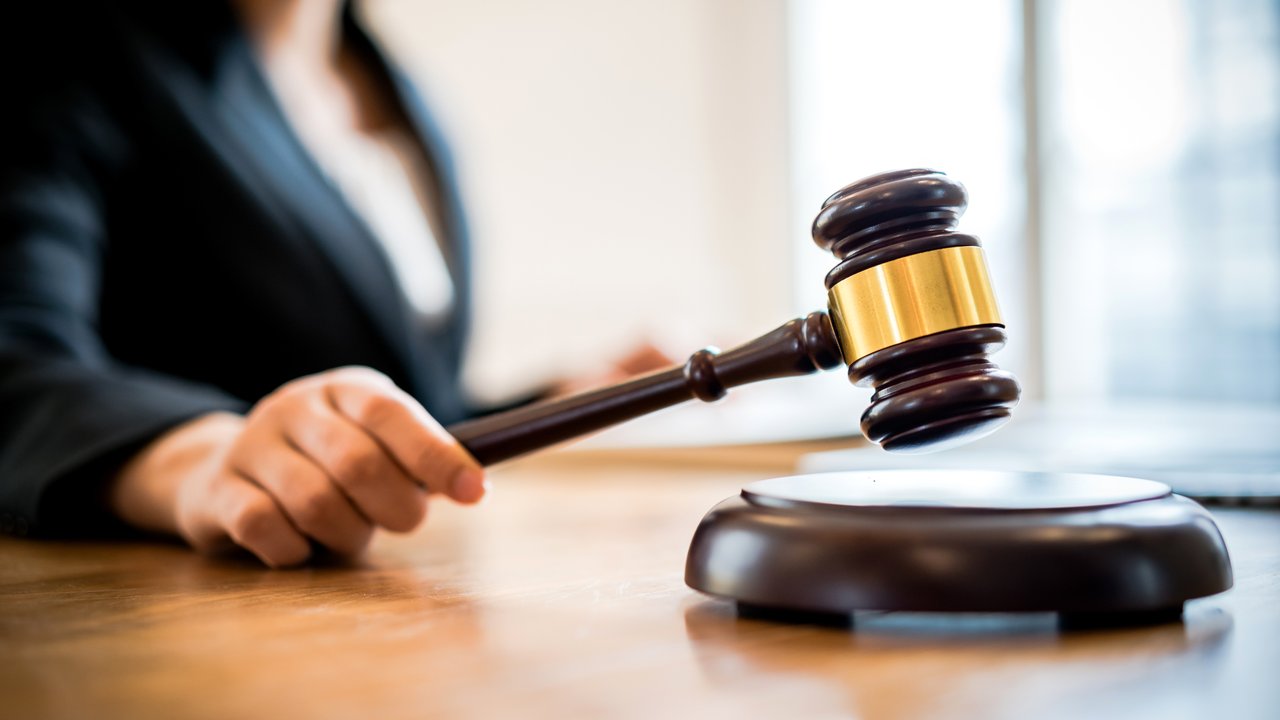 Female lawyer or judge with a gavel