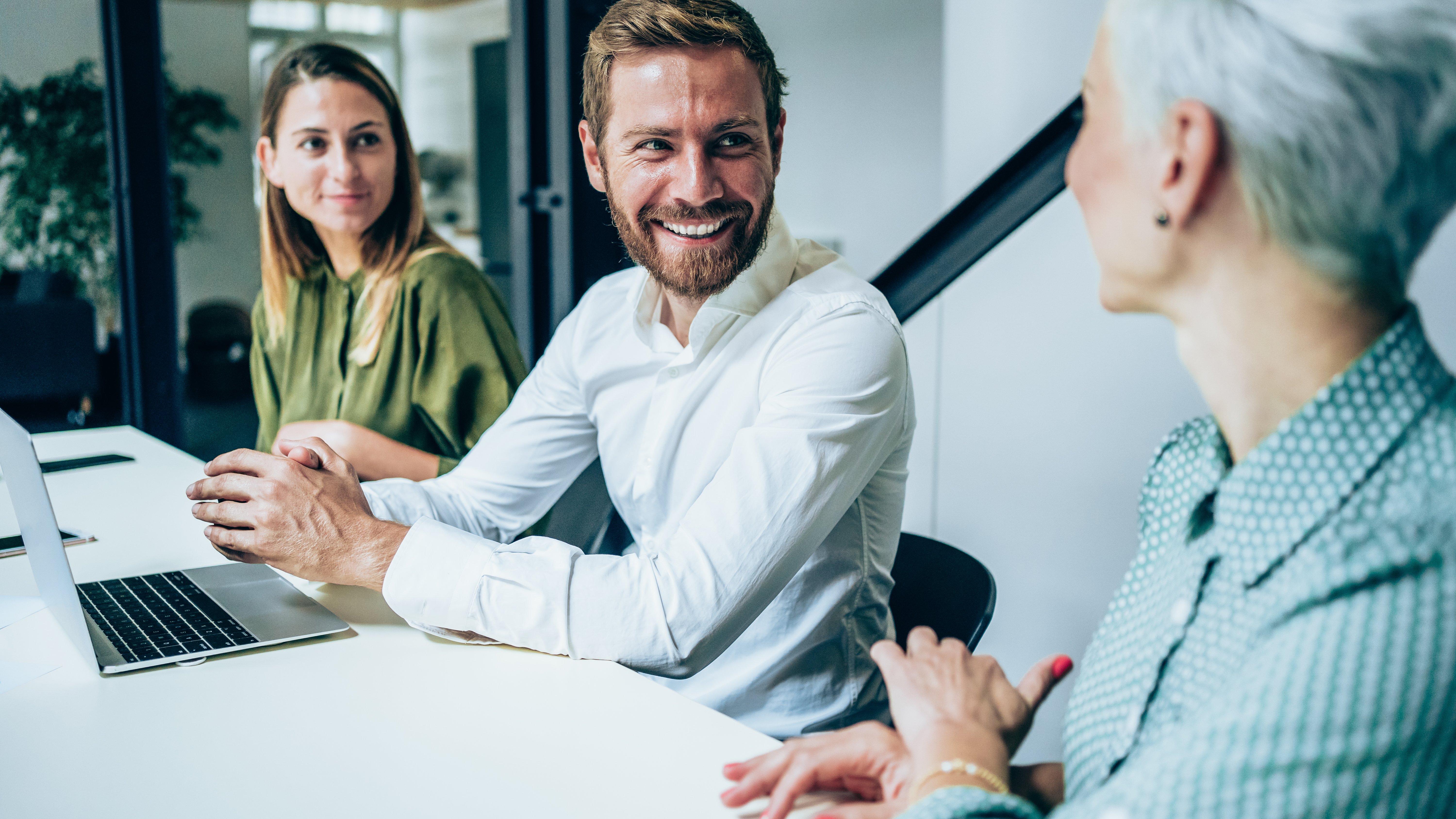 Business people listening to the accelerated underwriting survey results in meeting