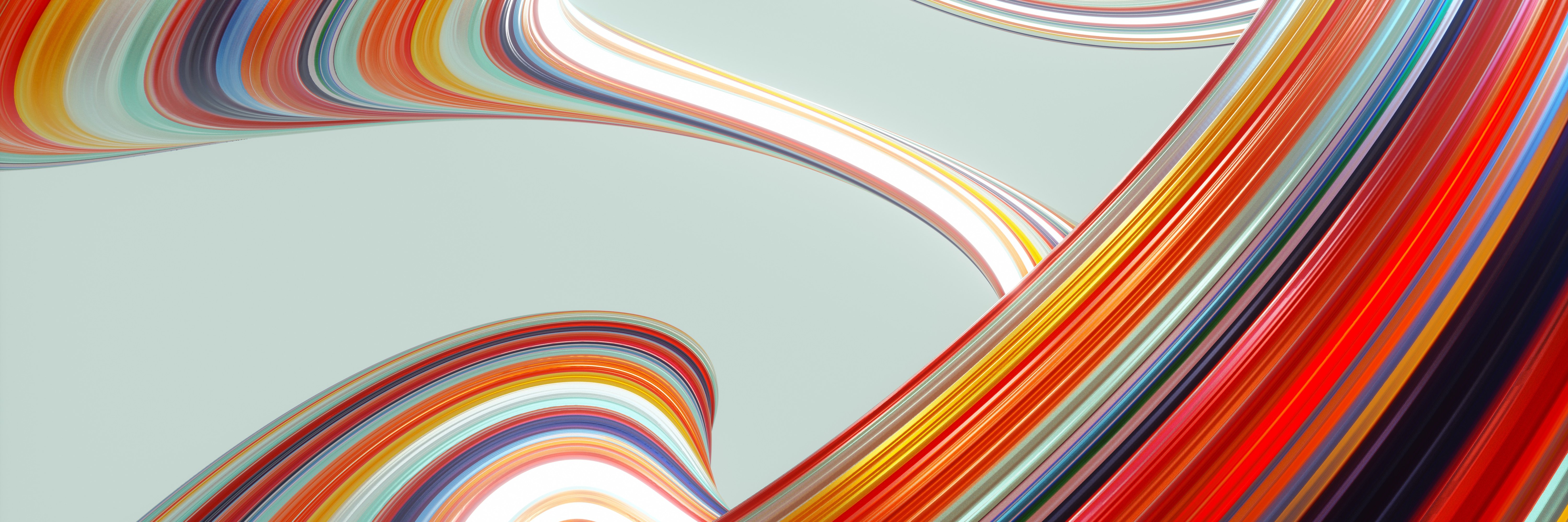 Digital generated image of multi coloured curved shape with striped pattern against grey background.