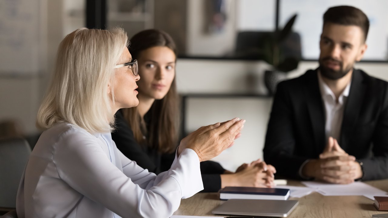 business meeting discussing survey results business meeting discussing survey results