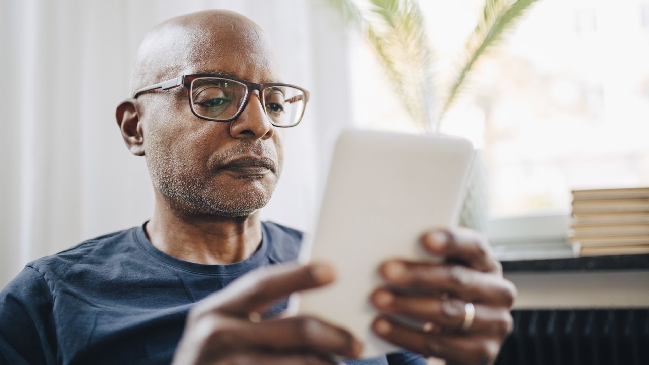 Retired senior reading ebook