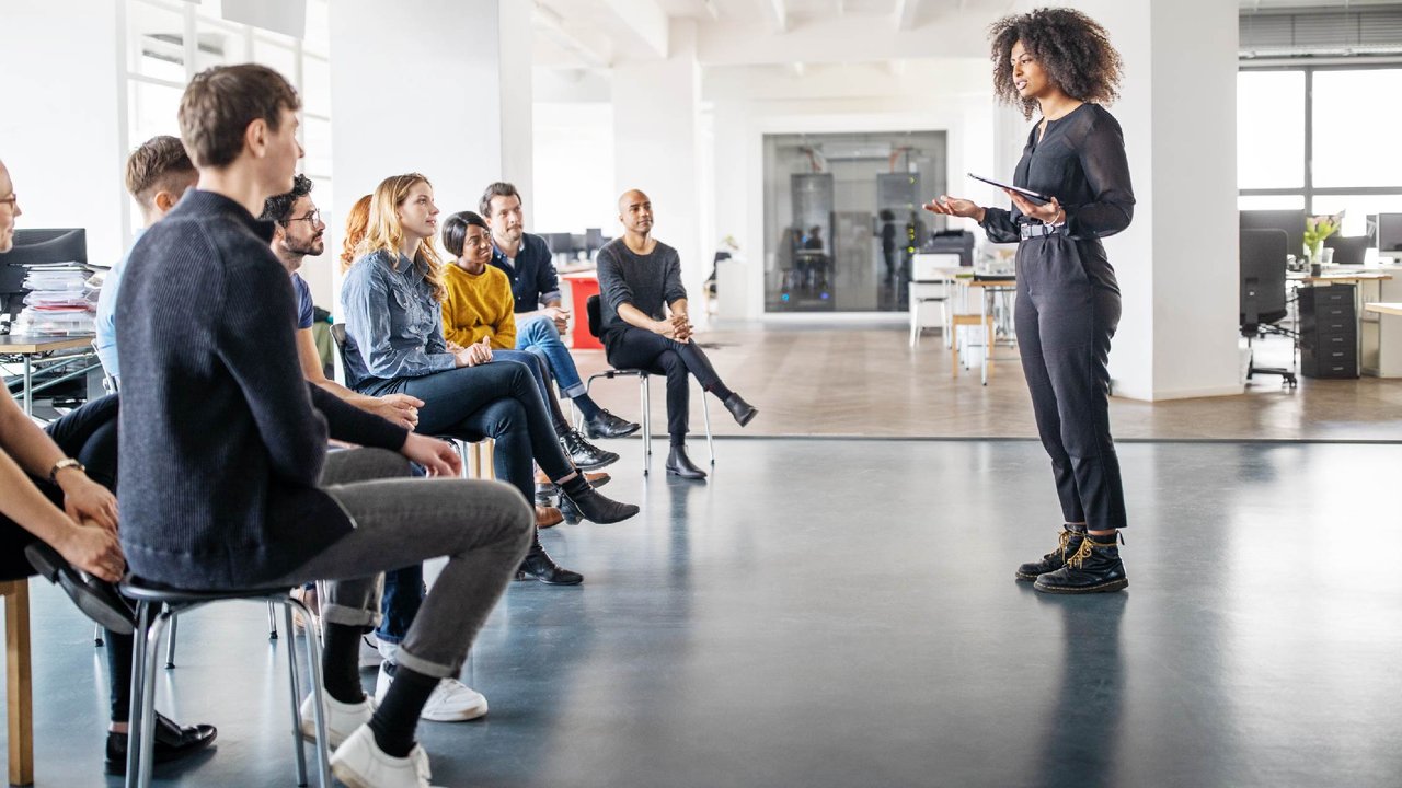 A woman training employees