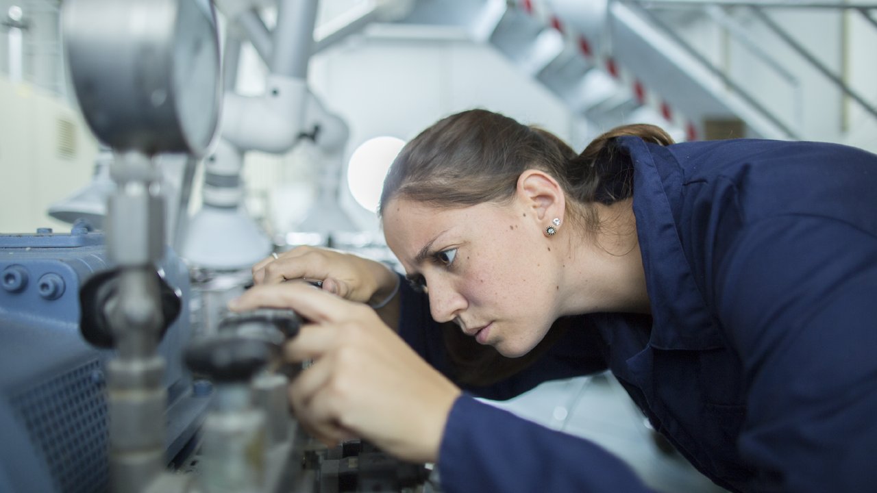 Woman pointing at machine