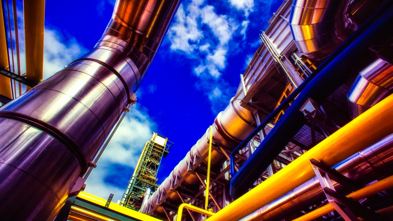 Large industrial silver, yellow, and blue pipes