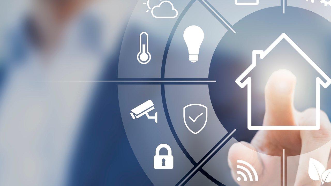 A person pointing at an interface of a connected smart home with automation devices