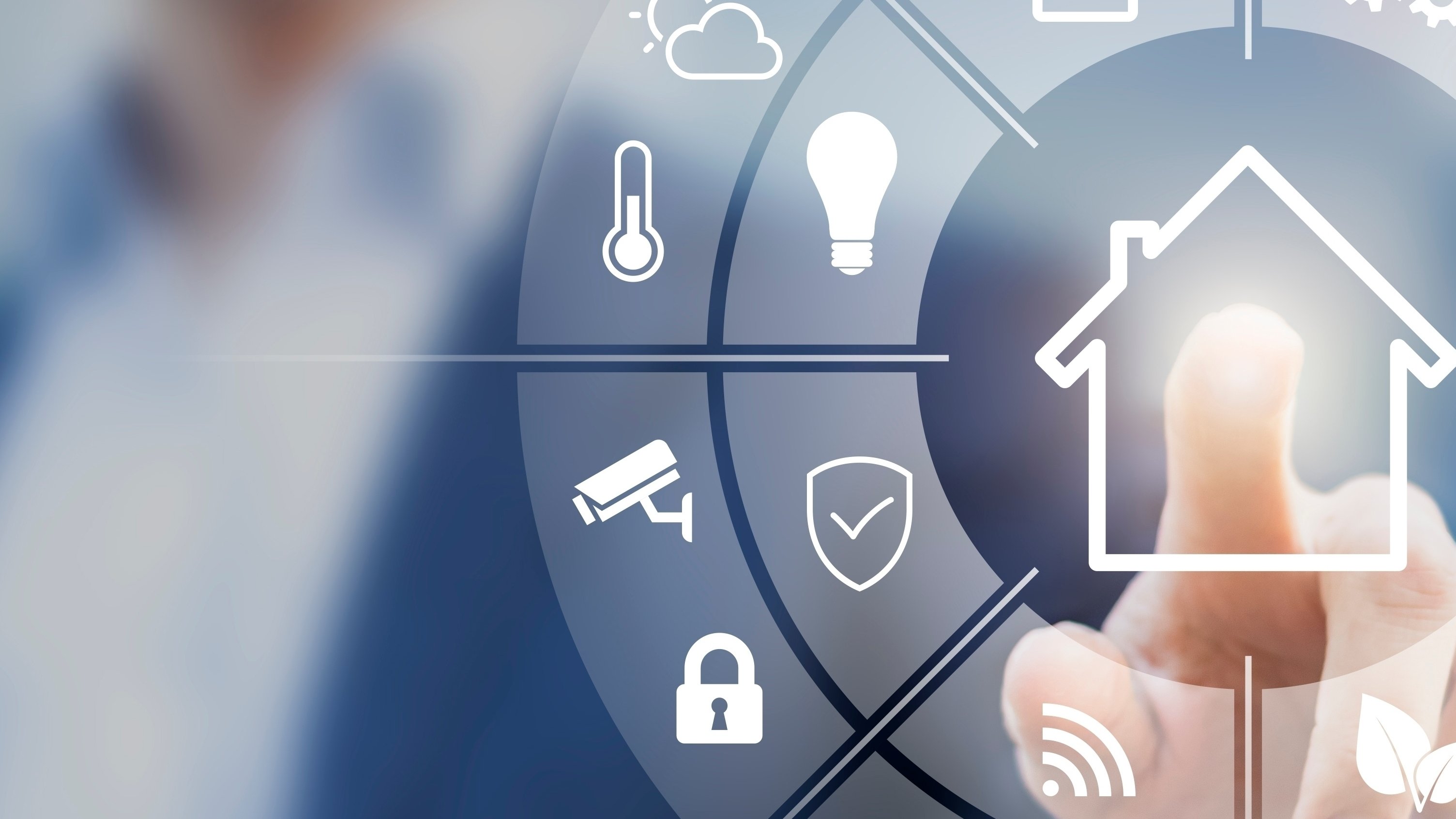 Personal insurance product lines for insurers A person pointing at an interface of a connected smart home with automation devices