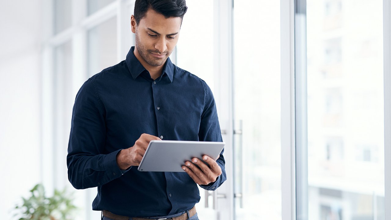 A person using a tablet at work