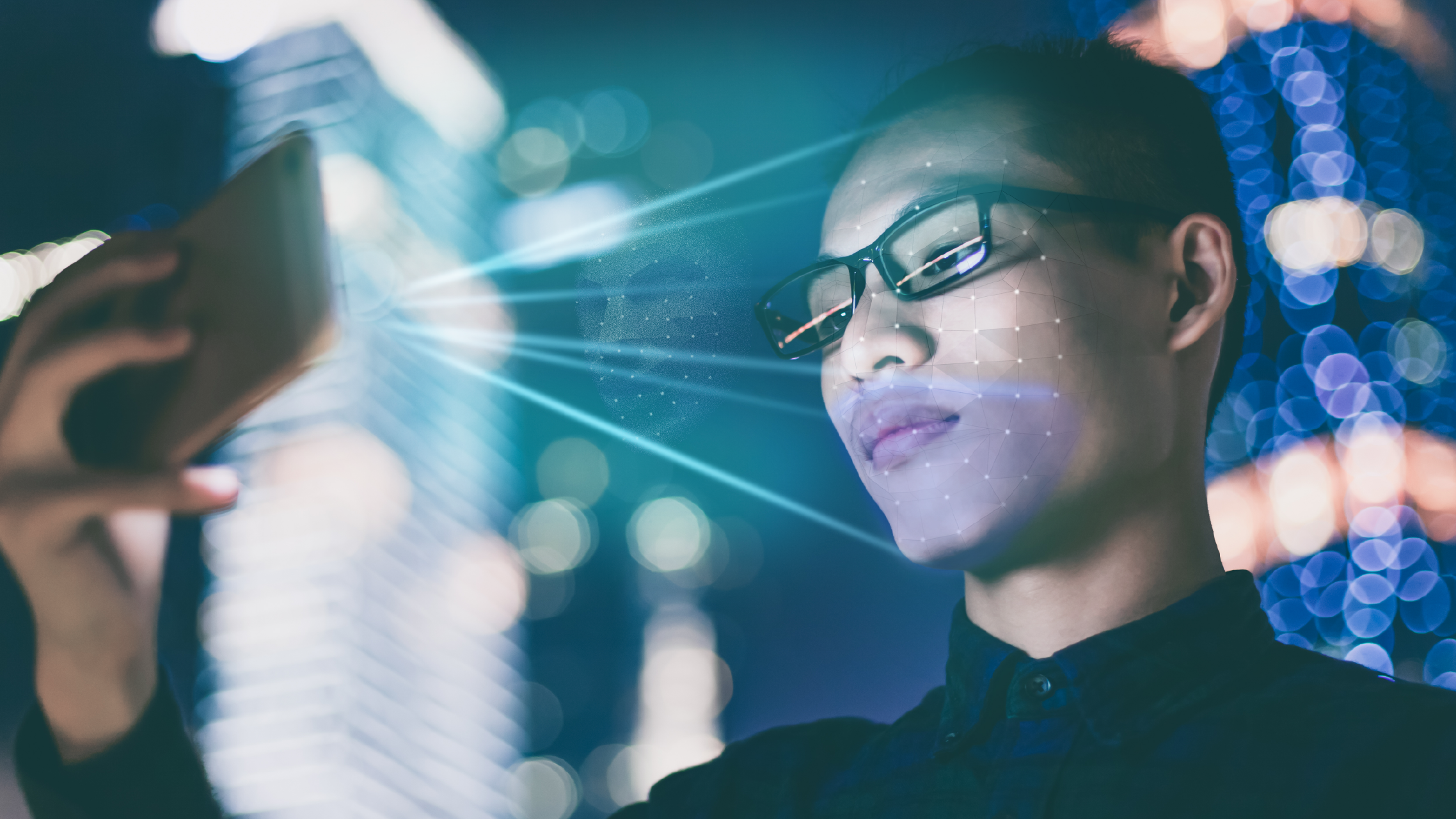 A person using face recognition technology on a smartphone in a public space