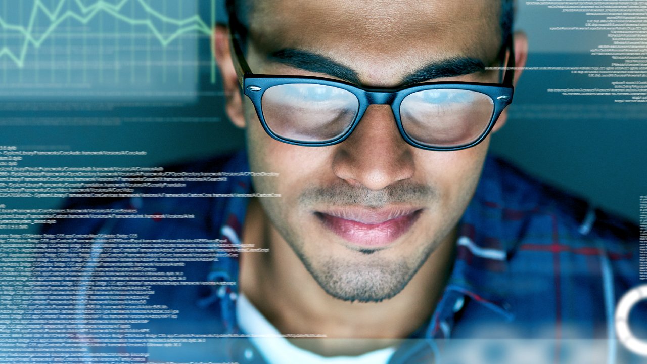 A programmer working on code exposing data digitally