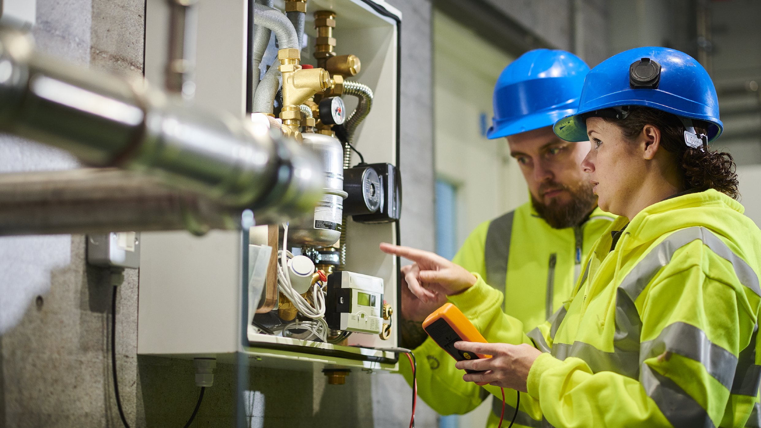 Electrical engineers in boiler room