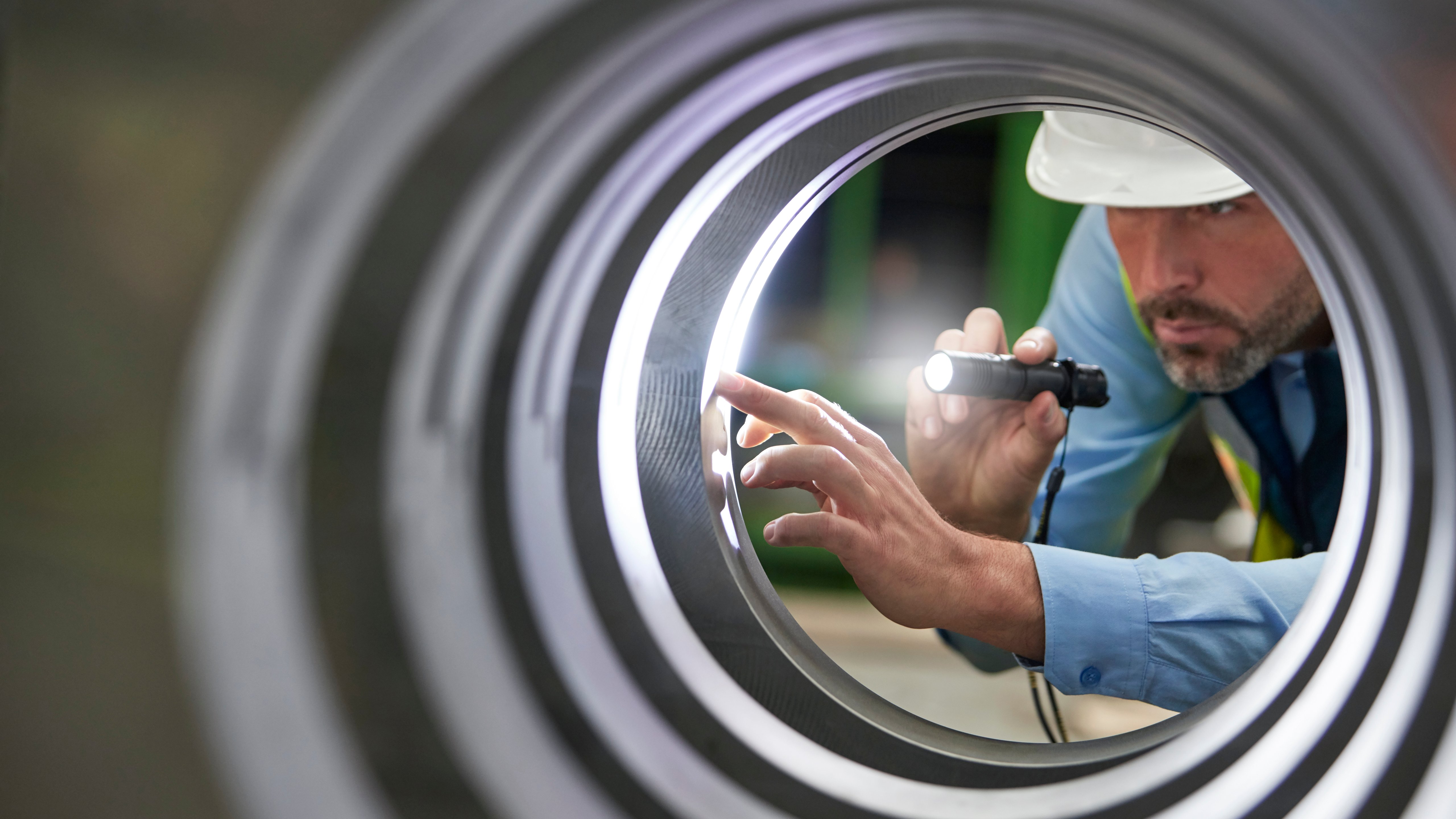 An inspector inspecting a cylinder form