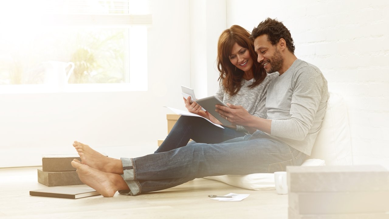 A couple at home requesting an inspection on a tablet