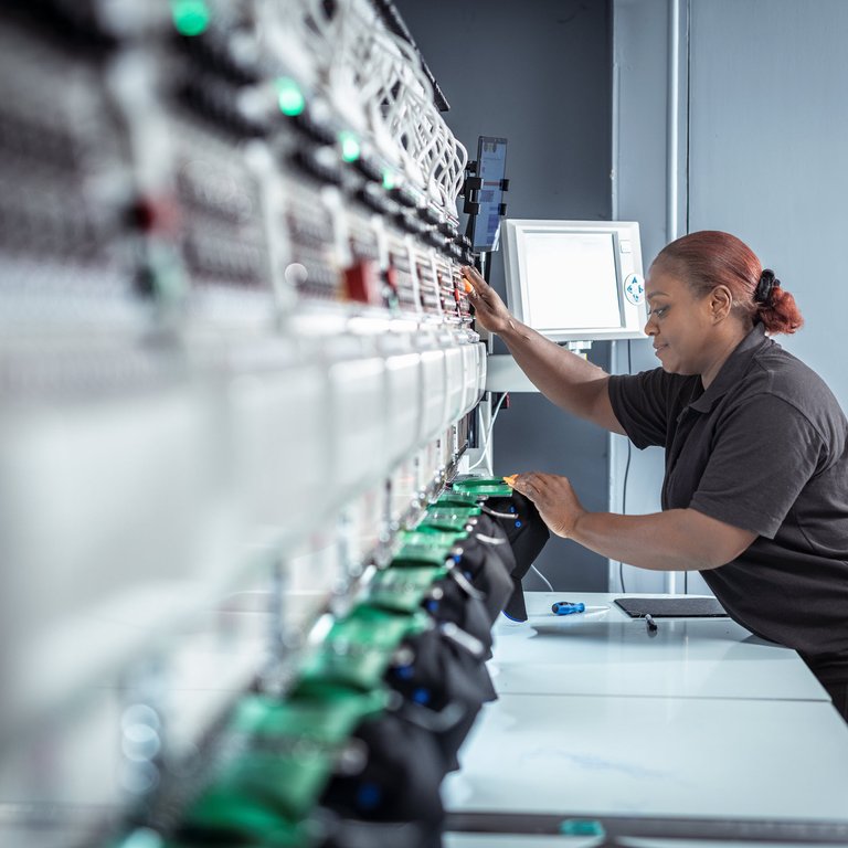 A woman working at a machine