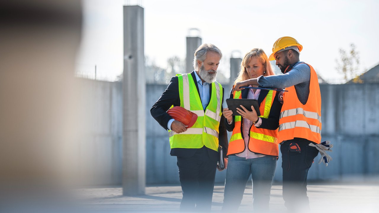 Three construction workers on a construction site