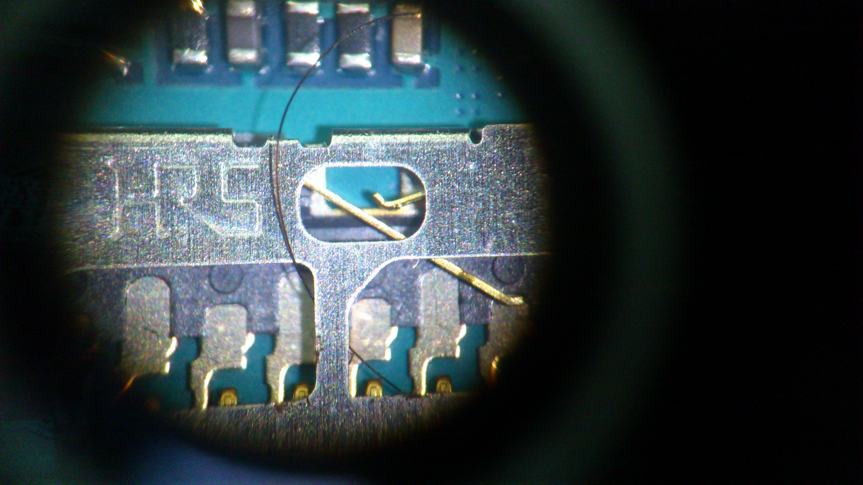 A strand of hair causing a microelectronic fault