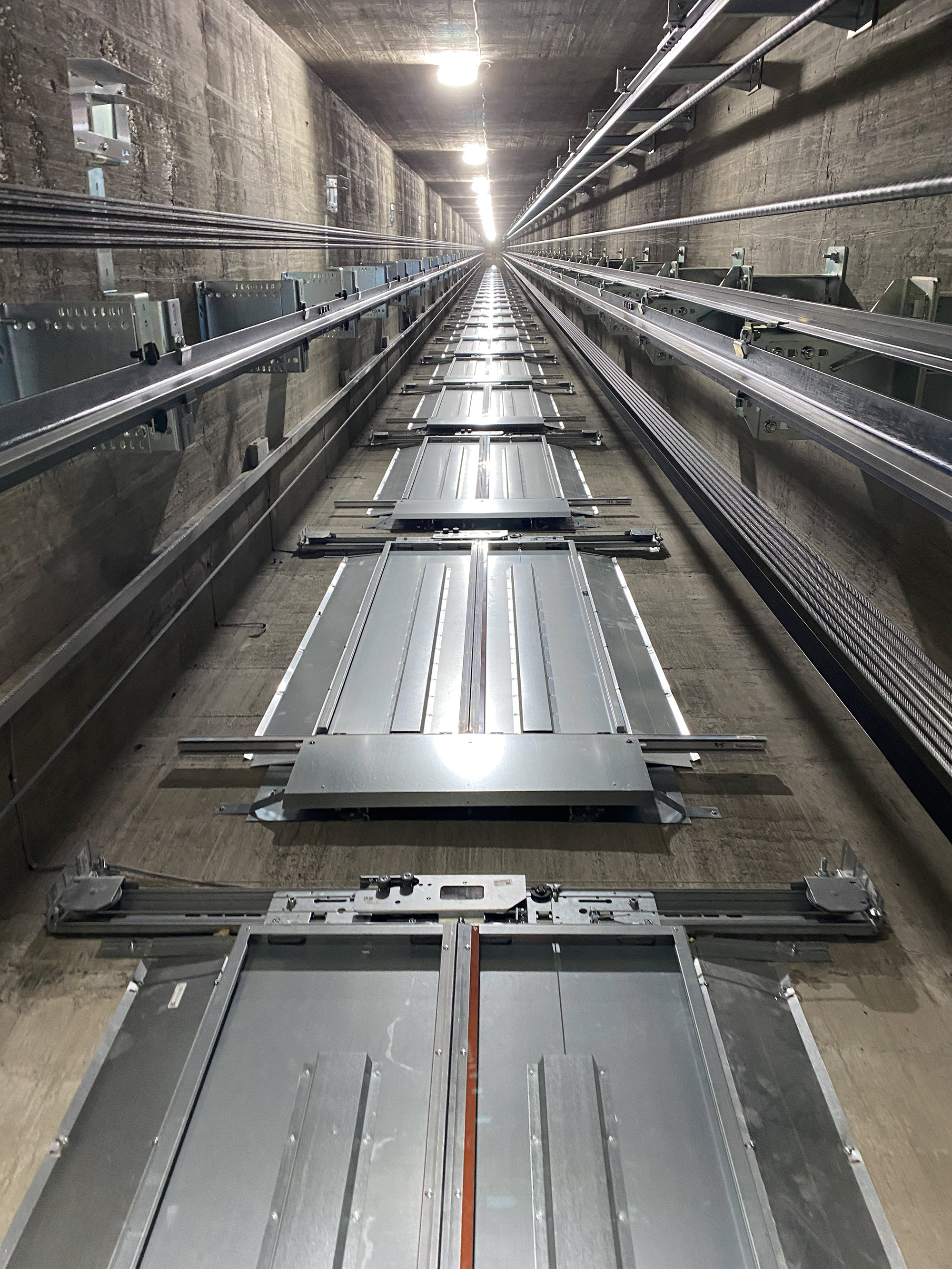 An elevator shaft in a tall, modern building