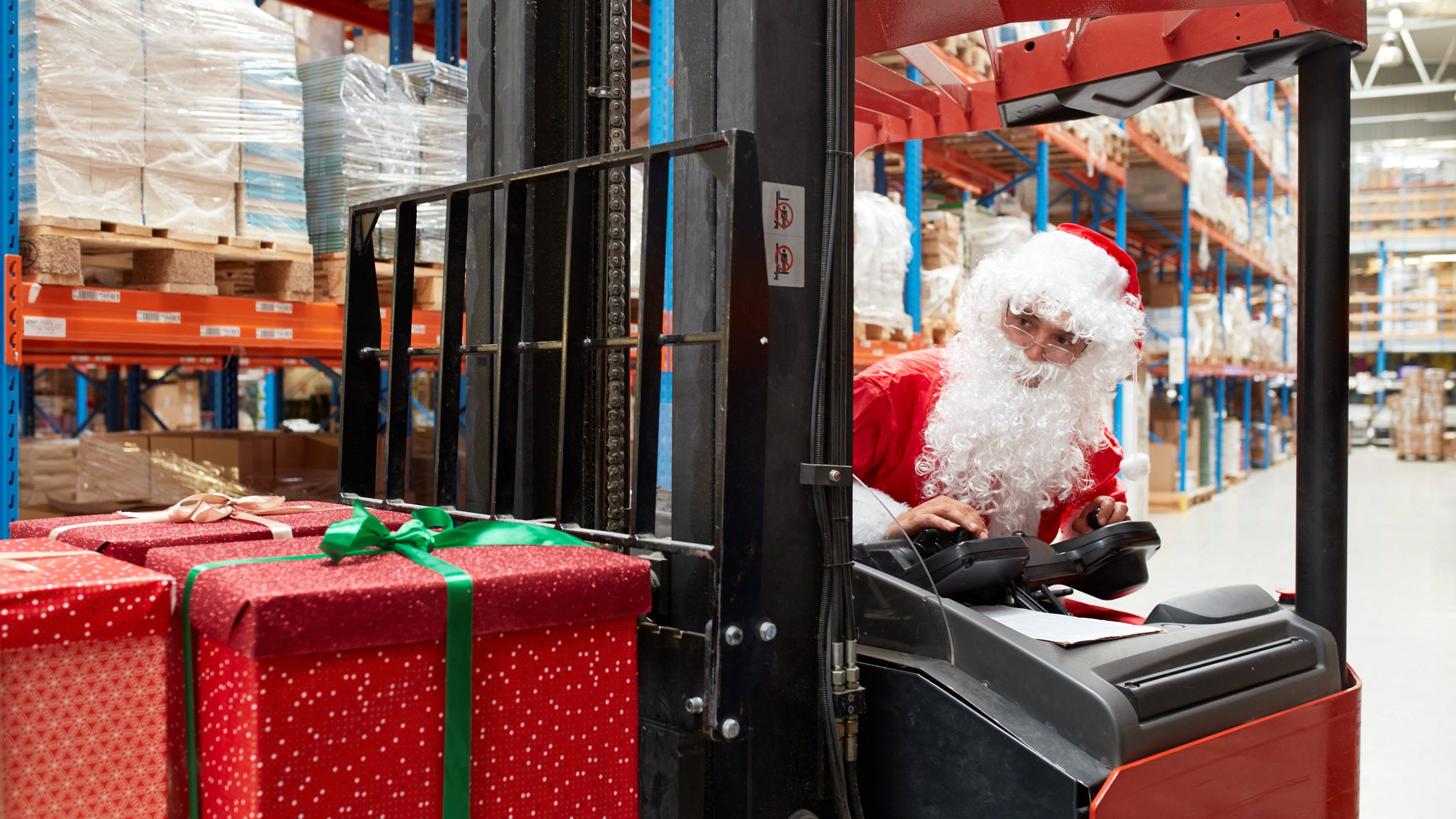 Father Christmas working in his warehouse