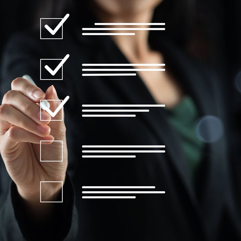 A woman ticking off a checklist