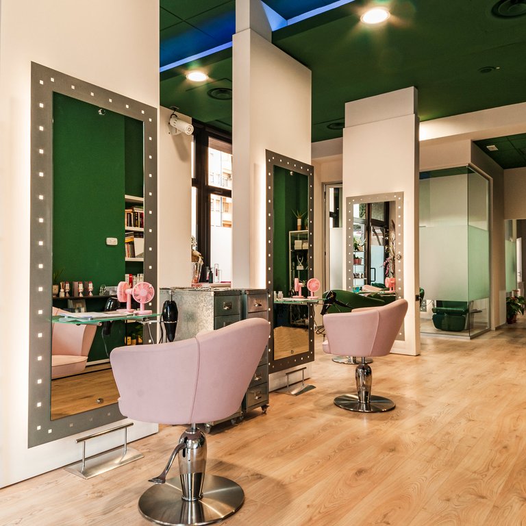 A hair salon, with chairs.