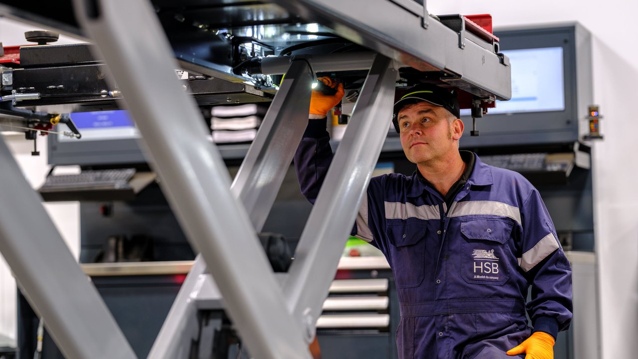 A HSB engineer performing a thorough examination of a hydraulic lifting table