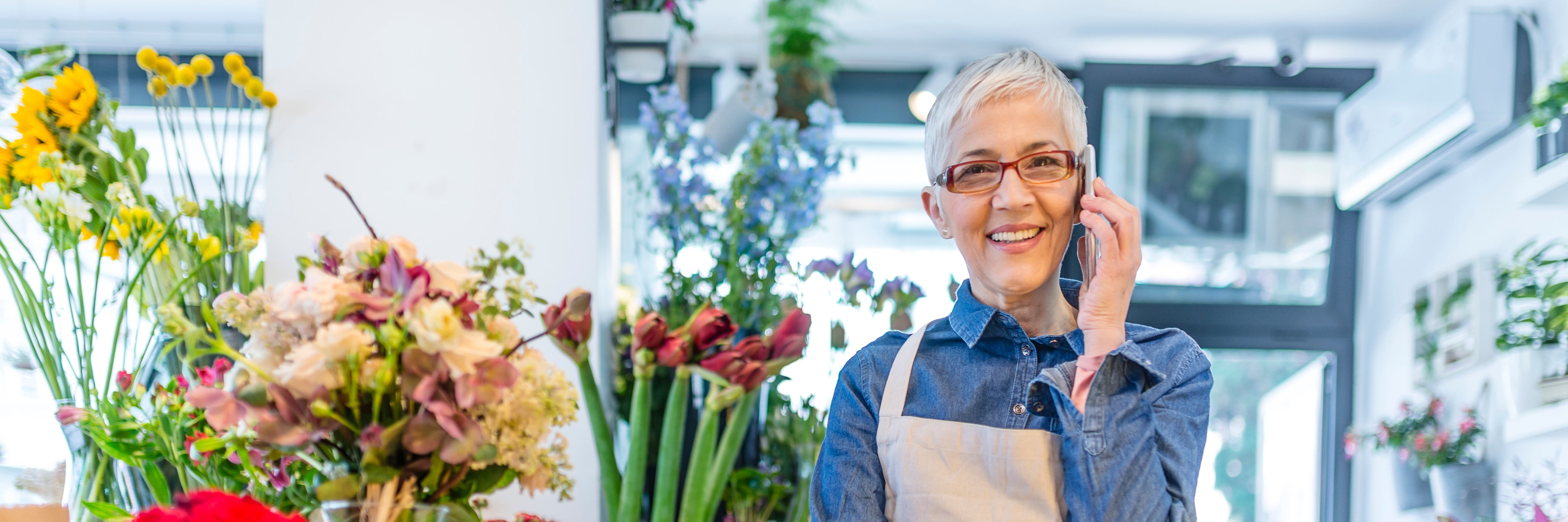 Mature flower shop owner at her small business