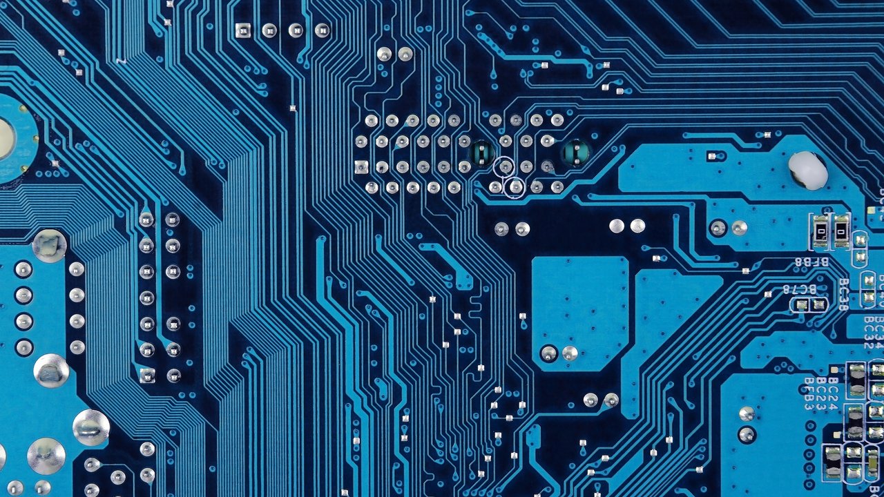 Close up of old printed blue computer circuit board