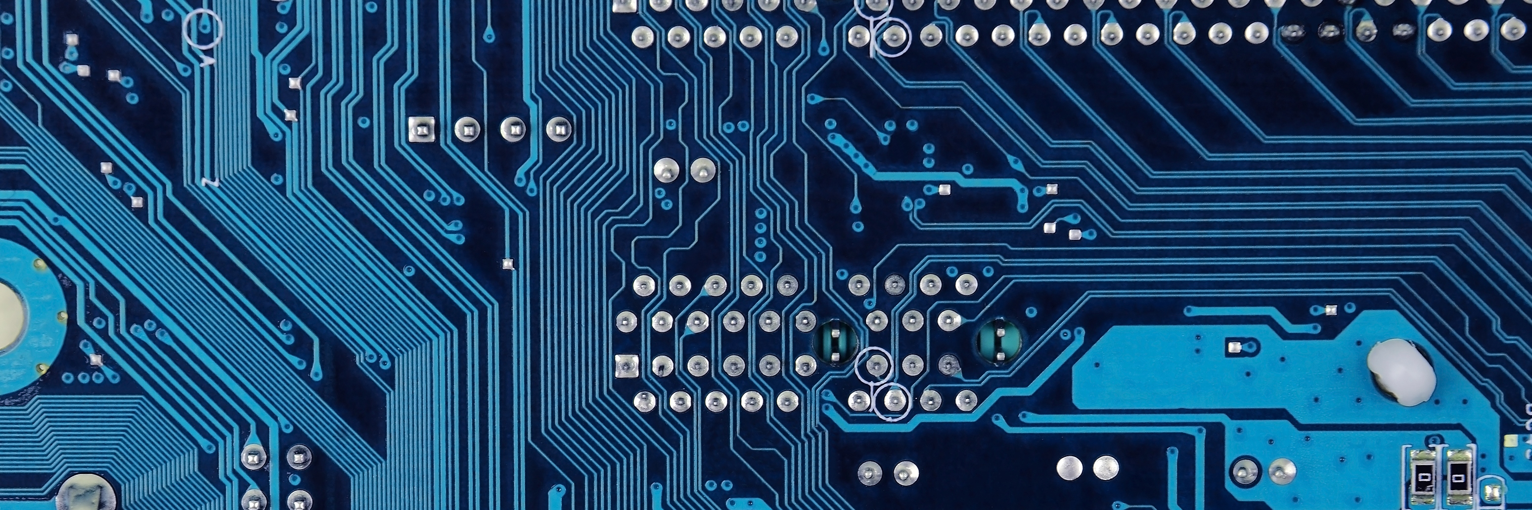 Close up of old printed blue computer circuit board