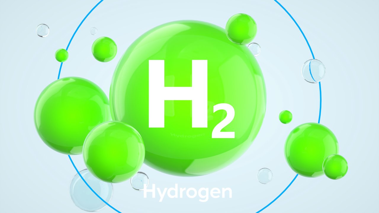 Digital generated image of green spheres forming H2 hydrogen icon against white background.
