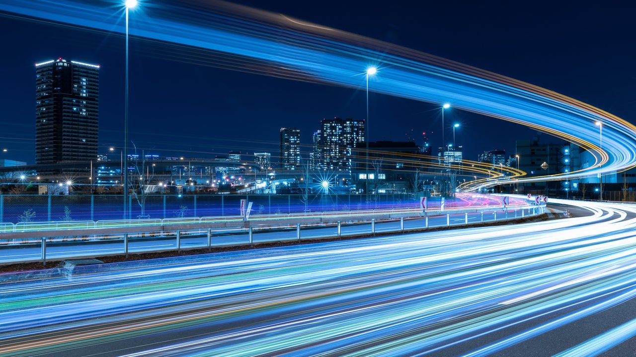 Highway night scene with moving car lights