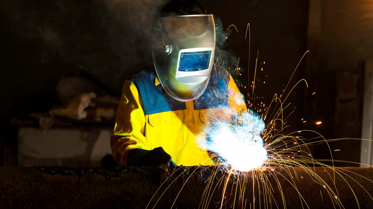 Industrial worker with welding tool