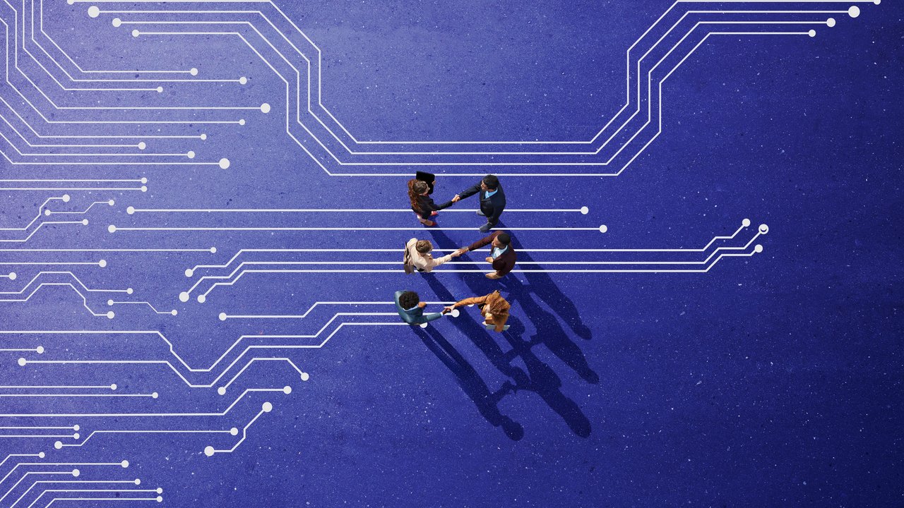 A vibrant blue background features abstract circuit patterns with white lines and dots, symbolizing technology and connectivity. In the foreground, a diverse group of individuals stands in a circle, engaged in a collaborative activity, casting long shadows that enhance the sense of depth and interaction.