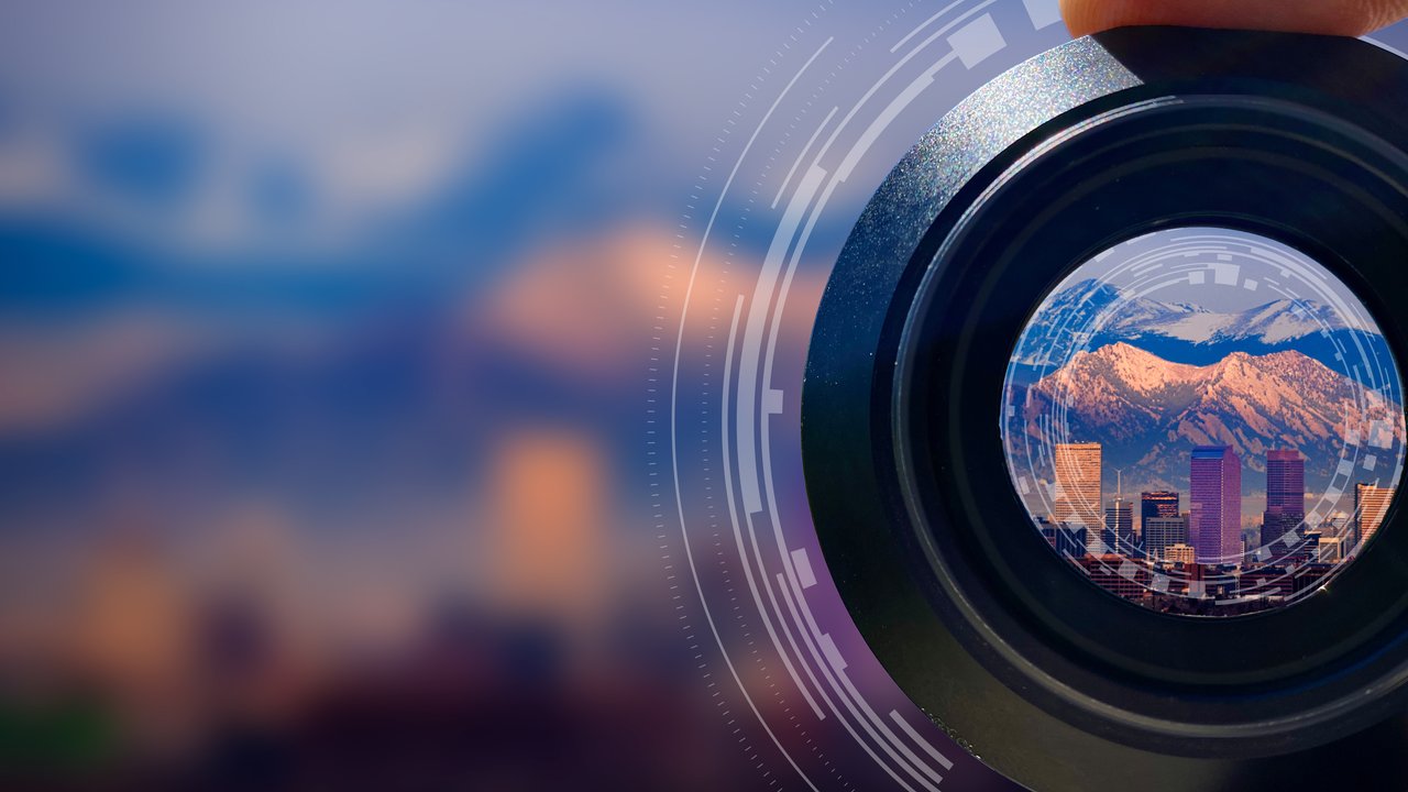 See your world differently. Close up view through camera lens of a horizon landscape in the distance