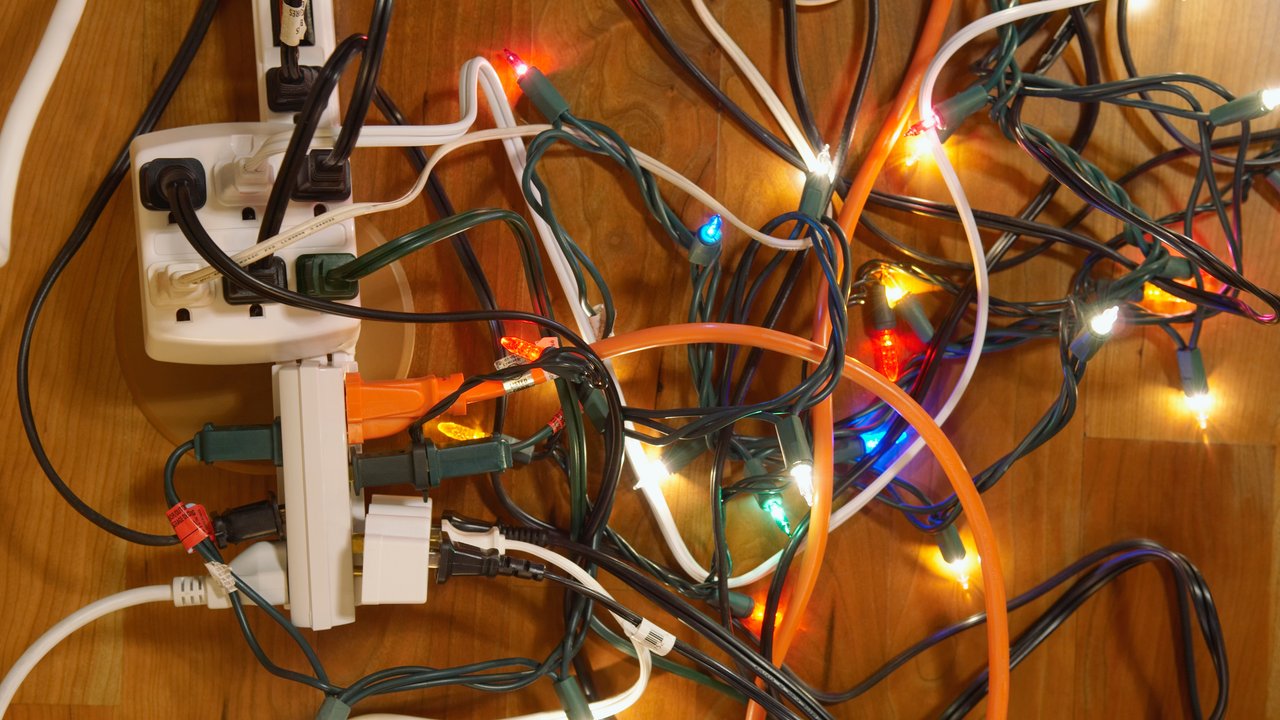 Holiday lights plugged in to power strips