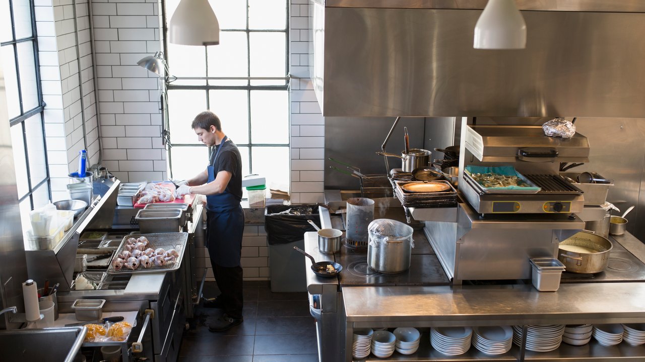 Small business owner in restaurant kitchen