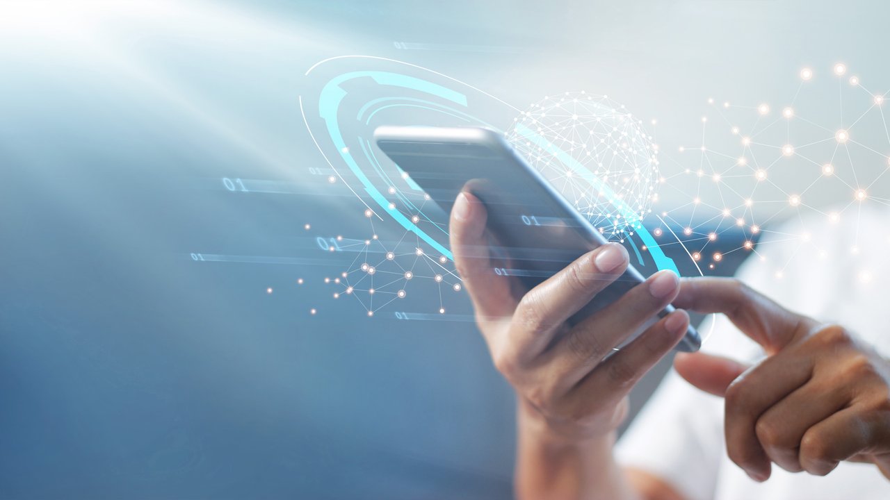 HSB Adds WhiteHaX® App to Cyber Insurance For Consumers Man using mobile smart phone with global network connection.