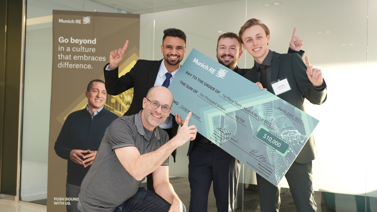 2025 MR Cup Winners Darbara Kaushal, Jayden Belza, Riley Mueller from the University of Manitoba posing their winning check.