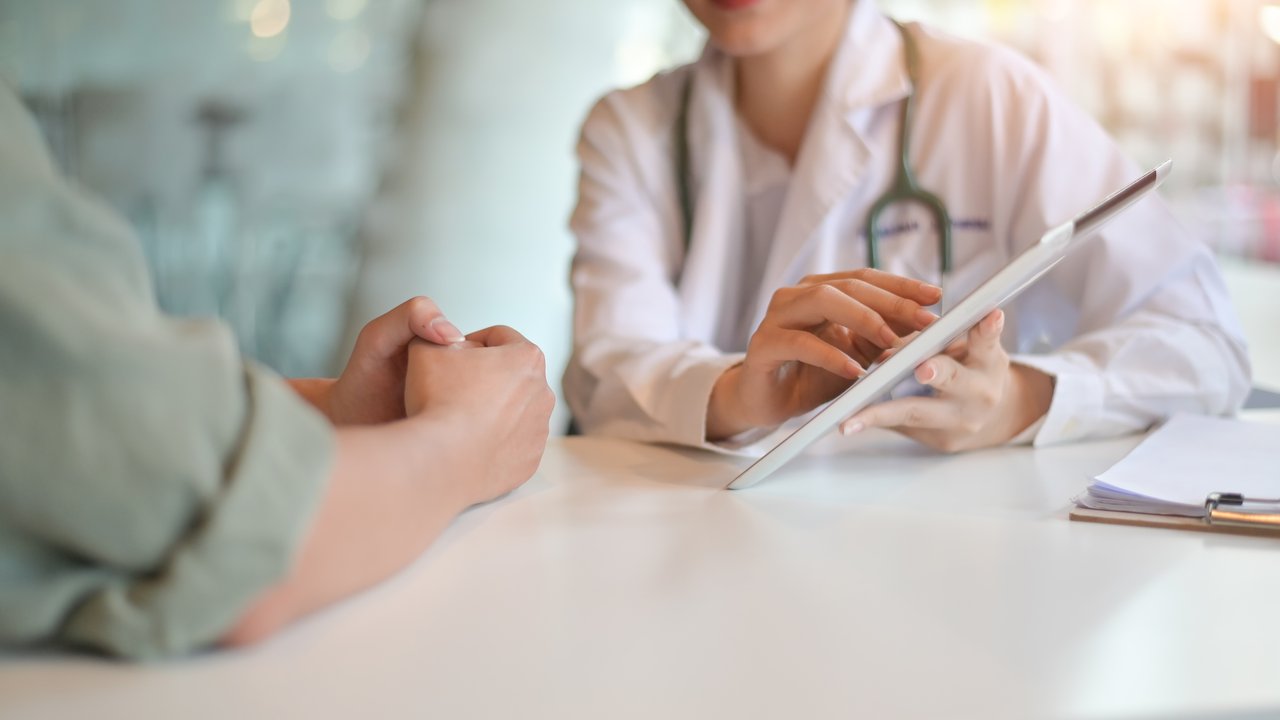 Doctor and patient looking over test results. 