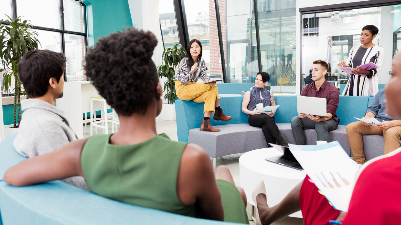 People at work in creative office space