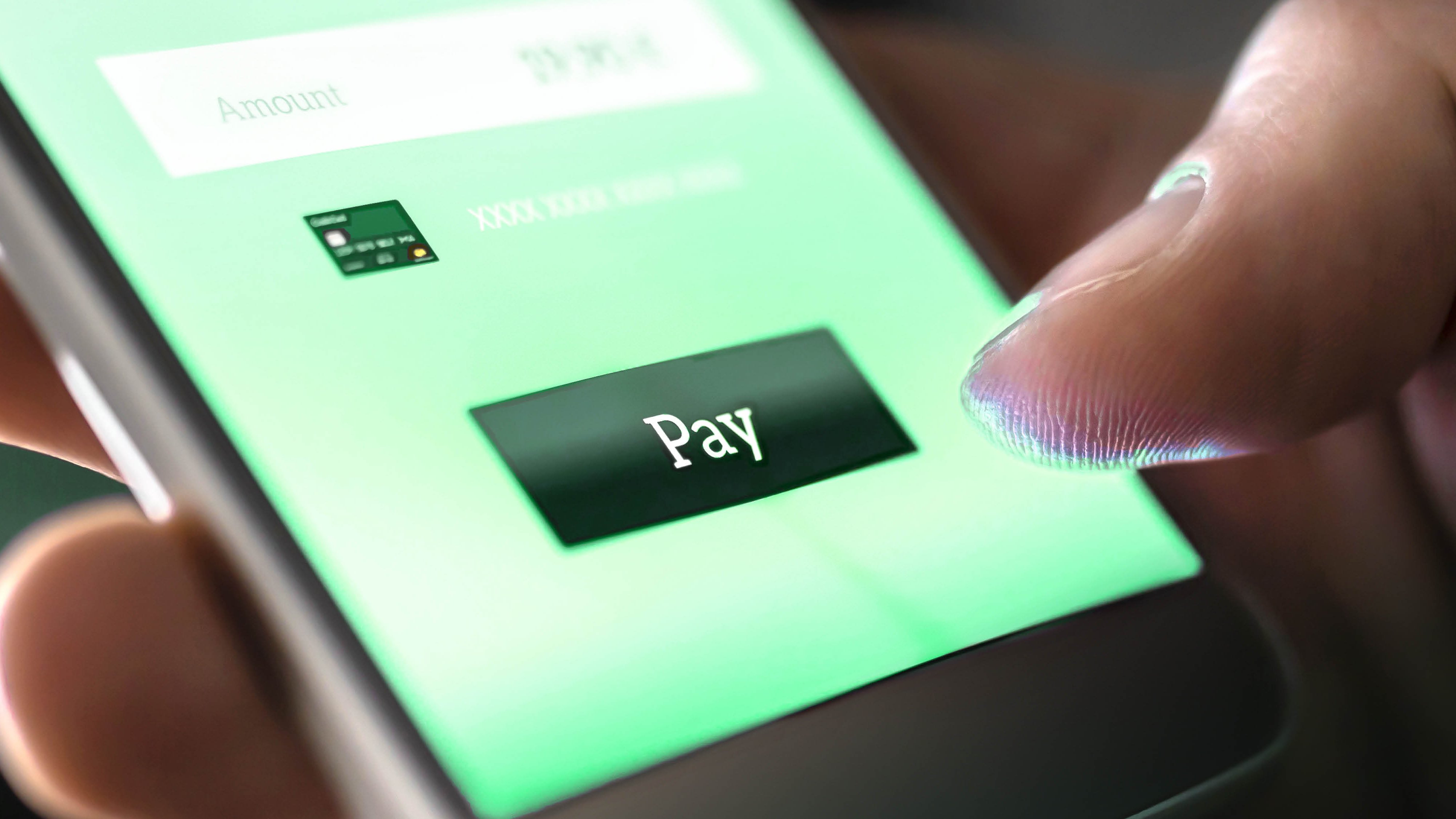 Cyber insurance for individuals and families – Munich Re's perspective on accumulation scenarios Mobile payment with wallet app and wireless nfc technology. Man paying and shopping with smartphone application and credit card information. Digital money transfer, banking and e commerce concept.