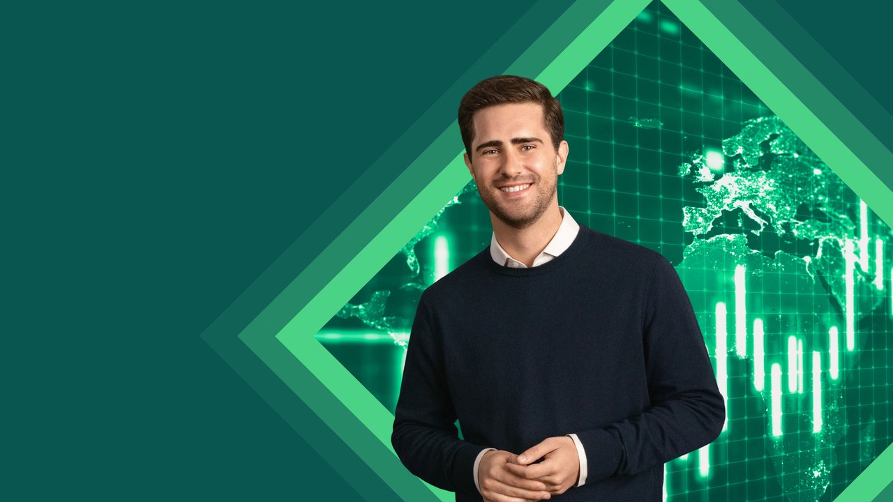 A man in a dark sweater stands in front of a green digital background with graphs and a world map.