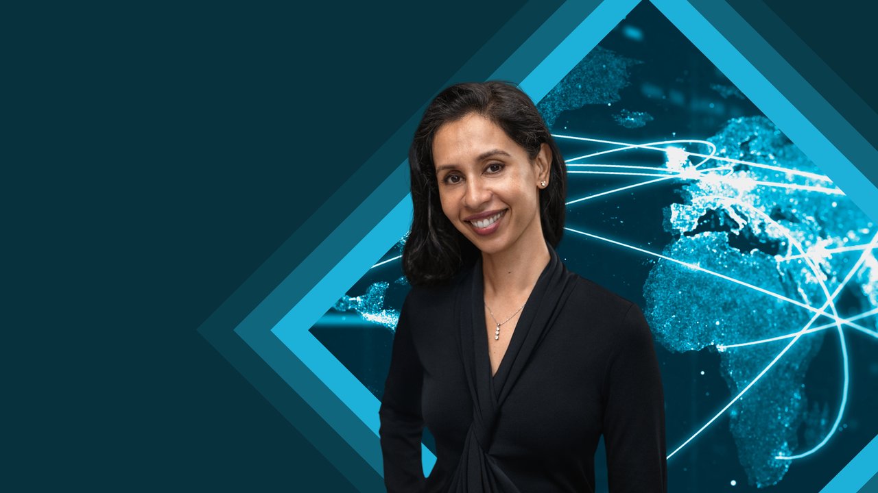 Women smiling with blue background