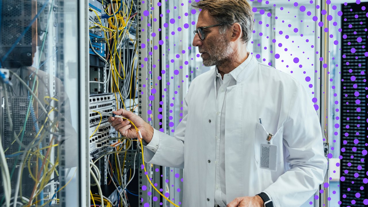 Male engineer fixing wires